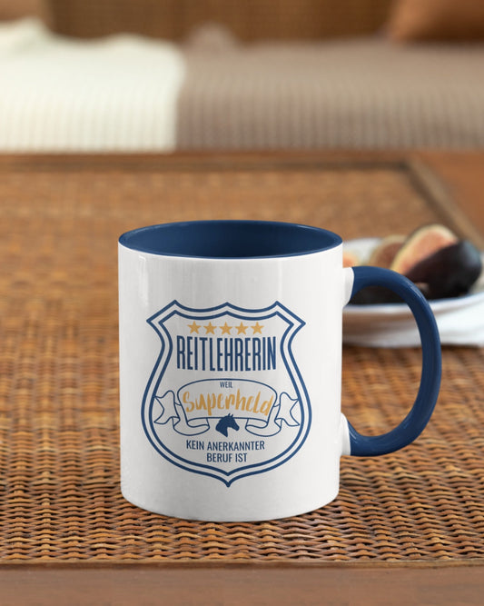 Geschenkidee, Keramiktasse für deine Reitlehrerin Spruch "Reitlehrerin weil Superheld kein anerkannter Beruf ist." 